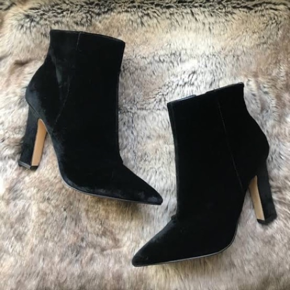 Black velvet booties with triangle heels